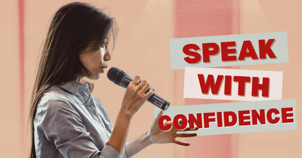 A confident woman speaking into a microphone on stage, with bold text overlay reading 'Speak with Confidence' in red and white