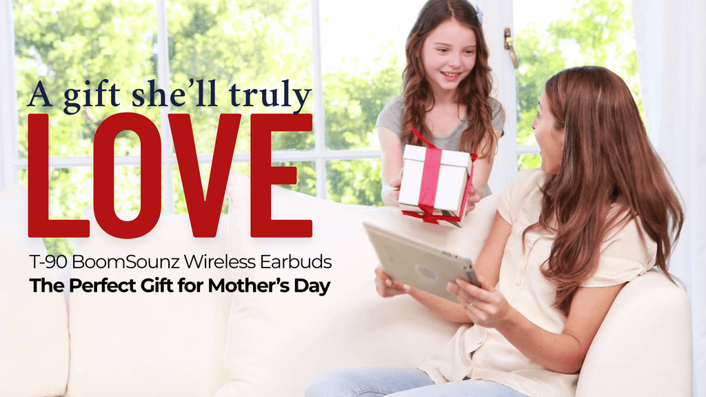 Smiling daughter giving a wrapped gift to her mother on a white couch, with overlay text that reads “A gift she’ll truly LOVE – T-90 BoomSounz Wireless Earbuds—The Perfect Gift for Mother’s Day.”